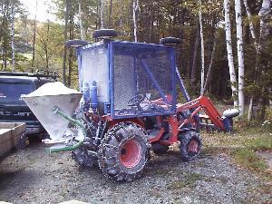 Five hundred pounds of Wollastonite loaded into a spreader on a 4wd tractor.