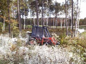 Wollastonite being spread to counteract the effects of acid deposition and to improve forest health.